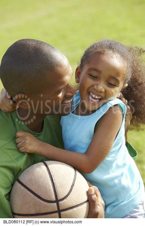 African American father hugging daughter