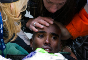 AP Photo/Craig Ruttle Mo Farah (center) of Great Britain is comforted ...