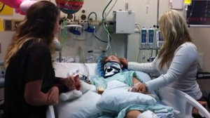 Jacoby Miles is shown in a hospital bed at Harborview Medical Center ...
