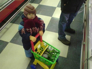 Baby With Beer In A Toy Shopping Cart