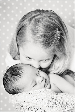 Whispering a secret to little sis by Rán B, via Flickr