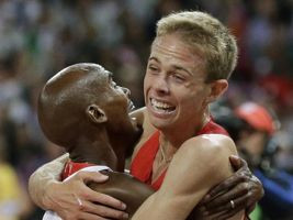 Britain's Mo Farah, left, and United States' Galen Rupp react after ...