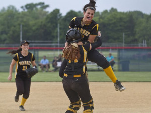 SJV's pitcher Ashley Ventura jumps into the arms of catcher Michelle ...