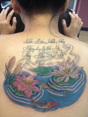 Quote And Lotus Flower Tattoo On Back