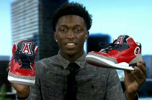 Arizona basketball recruit Stanley Johnson holds up his Jordan 3’s ...