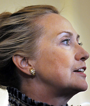 Secretary of State Hillary Clinton listens to Ambassador ...