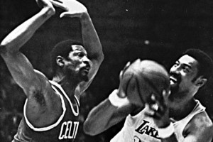 Chamberlain of the Los Angeles Lakers tries to shoot over Bill Russel ...