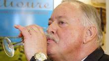 Former Quebec Premier Jacques Parizeau samples a glass of his new wine ...