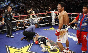 ... while Manny Pacquiao's wife Jinkee (right) smiles during the fight