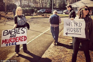 ... pro-life activists outside an abortion clinic near their home in