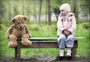 little girl meets teddy bear