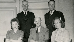 Otto Frank sits in the center surrounded by his Opekta co-workers ...