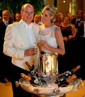 Prince Albert II enjoying the Champagne with Princess Charlene.
