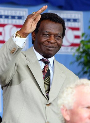 famer lou brock waves to the crowd as he is introduced at clark sports