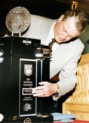 Tom Osborne places the University of Nebraska nameplate on the ...