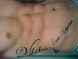 Motivational phrases in Spanish inked on ribs for everlasting ...