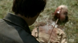 governor standing over a dead hershel whom he just decapitated hershel ...