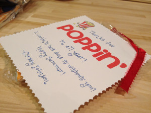 Stapled the note and ribbon to a bag of popcorn!
