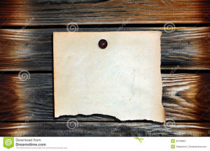 Blank Paper hanging on the Wooden Background.