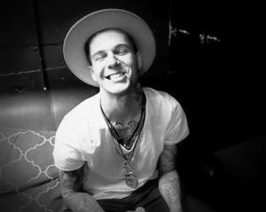 Tattoos, smiles, AND a voice! His hip-hop background brings just the ...
