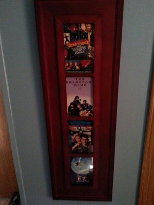 Picture frame with old vhs tape cases. Perfect for movie room