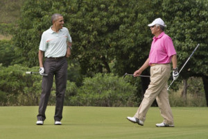 ... Najib Razak as they play golf. Source: AP Photo/Jacquelyn Martin
