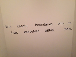 ... quote emblazoned on its stairwell wall: “We create boundaries only