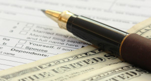 tax-form-with-pen-and-dollars-u-s-individual-income-tax-return-form ...
