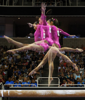 gymnast Sabrina Vega competes on the balance beam in this ...