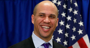 Newark Mayor Cory Booker smiles during a news conference. | AP Photo