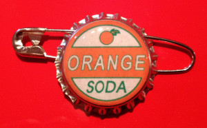 Young Ellie Up Pixar Orange soda ellie badge