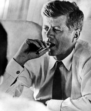 President John F. Kennedy smoking a cigar
