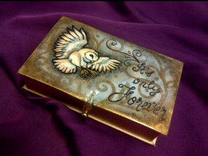 Next is an old gold Estee Lauder gift box that I thrifted. I just ...