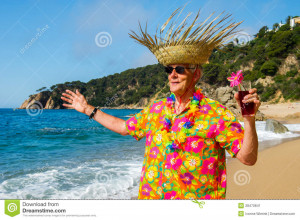 Stock Image: Senior man with cocktail drink at the beach