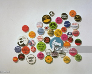 Variety of button pins containing symbols & quotes fr. 1960's Amer ...