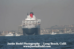 The Queen Mary 2 with the City of Long Beach in the background