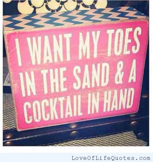Toes in the sand, cocktail in hand
