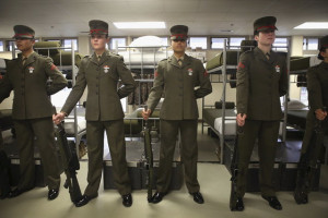 Female Marine recruits stand for inspection near the end of their stay ...