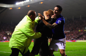 Tim Cahill Everton player Tim Cahill r and a fan celebrate the