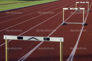Running tracks with three hurdles - Stock Image