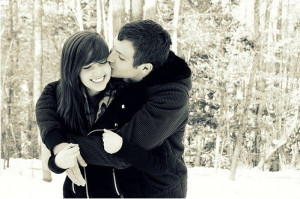 cute couple kissing in the snow