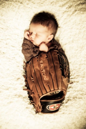 newborn pictures in daddy's or mommy's baseball glove :)