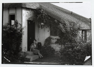 Marjory Stoneman Douglas with cat outside her home in Coconut Grove