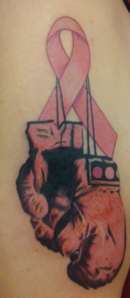 Breast Cancer Survivor Tattoo with a pair of boxing gloves