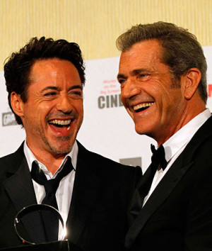 Actor Mel Gibson, right, presents actor Robert Downey, Jr., with the ...