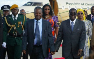 Zambian President Michael Sata is met by President Robert Mugabe. The ...