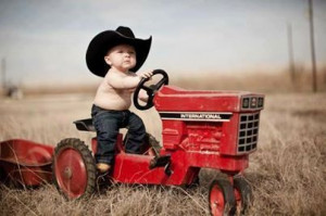 Little baby boy on tractor. Love it!