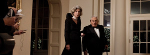 Former Secretary of State Henry Kissinger, shown here with his wife ...