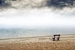 Feeling Empty Inside Depression An empty bench at the seaside