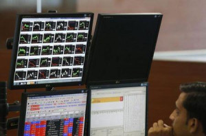... displaying live stock quotes on the floor of a trading firm in Mumbai